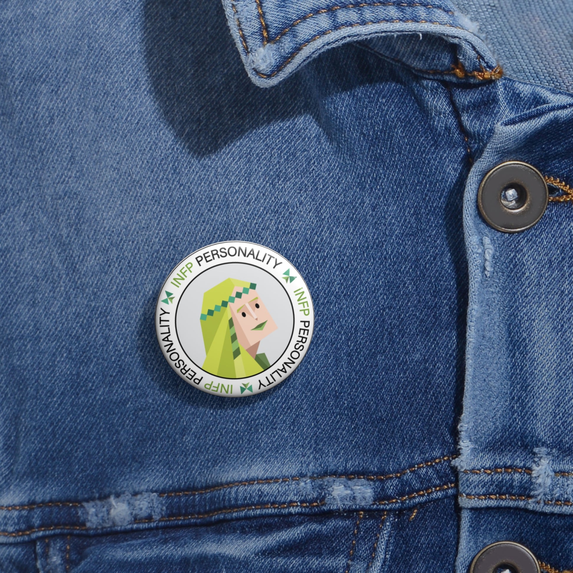 INFP Community Pin Button displayed on a jacket lapel, showcasing the whimsical design and vibrant colors of the pin.